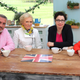 Hollywood poses in a tight pink button-down next to his delightful former co-hosts. Image via PBS.